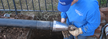 man working on pipe bursting project