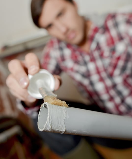 Making the connection: cutting, priming, and gluing PVC pipes