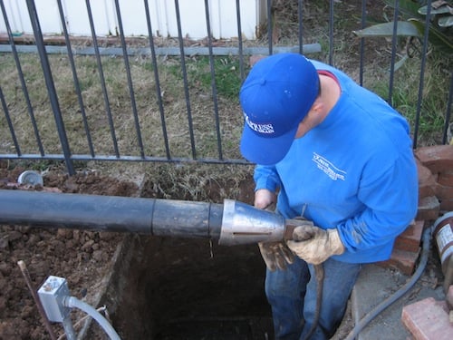 plumbing professional providing pipe bursting services