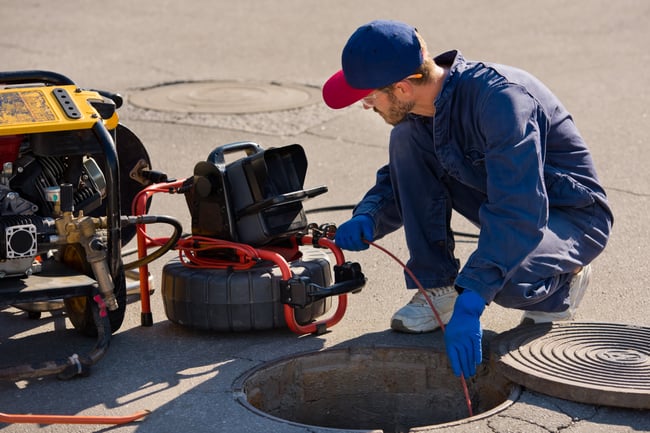 plumber-doing-pipe-inspection