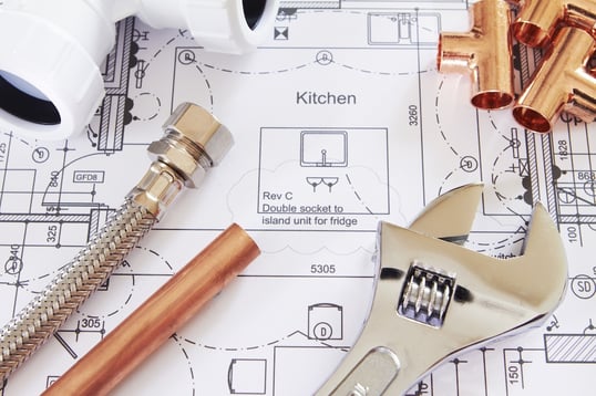 plumbing tools and blueprints