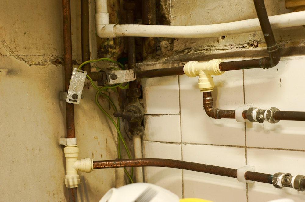 Top Common Plumbing Problems In Old Houses And How To Solve Them - Public Bathroom Sink Water Pipe Leaking From Wall Connection